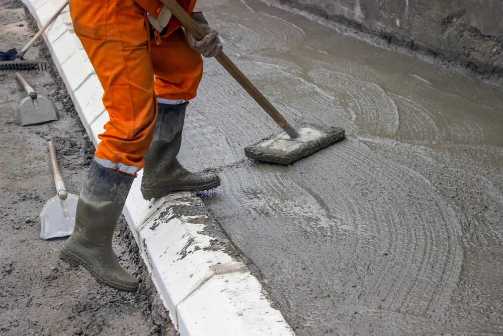 a person showing how to raise a sidewalk